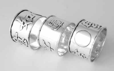 Three Chinese Silver Napkin Rings